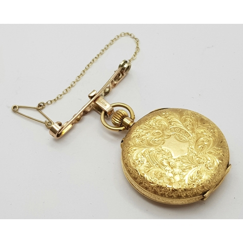 9 - A Vintage 18K Gold Miniature Pocket Watch. A beautifully engraved half-hunter design. Top winder. Wh... 