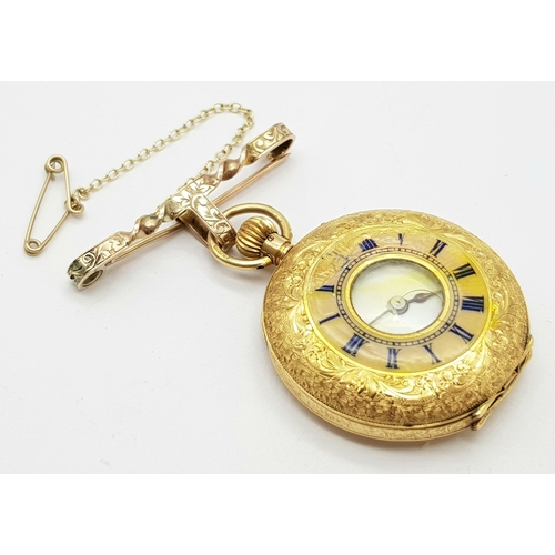 9 - A Vintage 18K Gold Miniature Pocket Watch. A beautifully engraved half-hunter design. Top winder. Wh... 