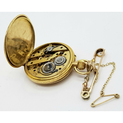 9 - A Vintage 18K Gold Miniature Pocket Watch. A beautifully engraved half-hunter design. Top winder. Wh... 