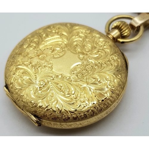 9 - A Vintage 18K Gold Miniature Pocket Watch. A beautifully engraved half-hunter design. Top winder. Wh... 