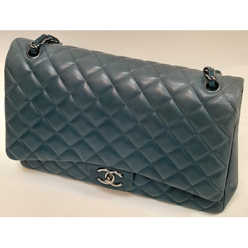 556 - A Chanel Teal Jumbo Classic Double Flap Bag. Quilted leather exterior with silver-toned hardware, ch... 