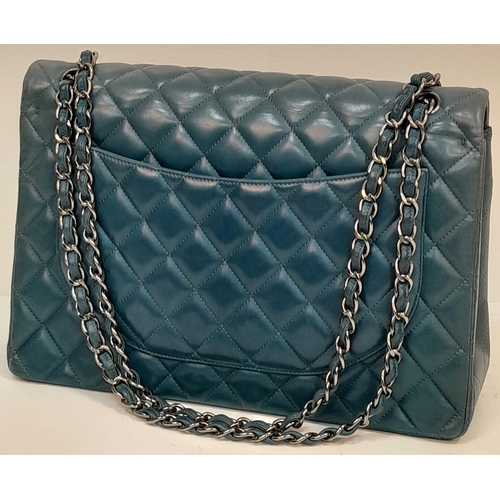 556 - A Chanel Teal Jumbo Classic Double Flap Bag. Quilted leather exterior with silver-toned hardware, ch... 