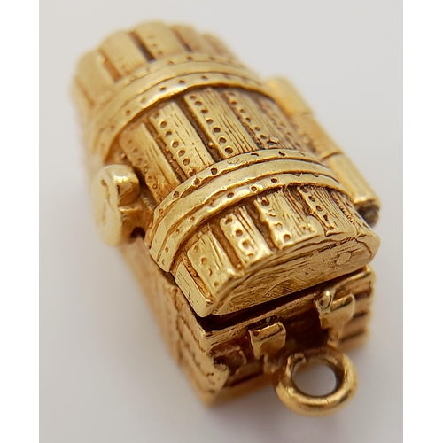 113 - A 9K YELLOW GOLD TREASURE CHEST CHARM, WHICH OPENS TO REVEAL THE TREASURE INSIDE. 2cm length, 6.5g w... 