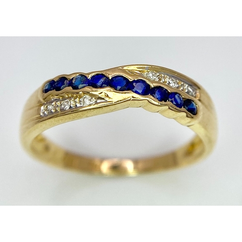 176 - AN 18K YELLOW GOLD DIAMOND & BLUE STONE (PROBABLY SAPPHIRE) CROSSOVER RING. Size O, 2.7g total weigh... 