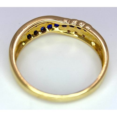 176 - AN 18K YELLOW GOLD DIAMOND & BLUE STONE (PROBABLY SAPPHIRE) CROSSOVER RING. Size O, 2.7g total weigh... 