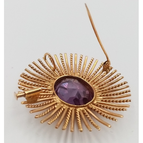 218 - A 16K (TESTED AS) YELLOW GOLD STARBURST DESIGN BROOCH ALSO WITH PENDANT BAIL, SET WITH A 2CM X 1.5CM... 