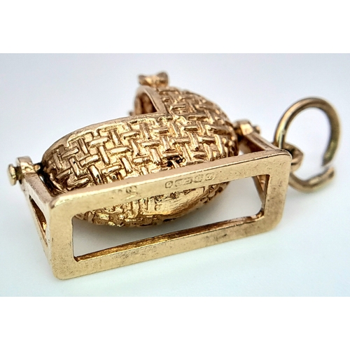 288 - A 9K YELLOW GOLD BABY CRIB CHARM, WHICH MOVES. 2.6cm length, 3.7g total weight. Ref: SC 8010