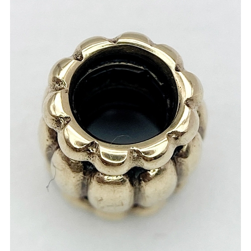 453 - A 14K YELLOW GOLD PANDORA CHARM. 7mm length, 2.2g weight. Ref: SC 8134