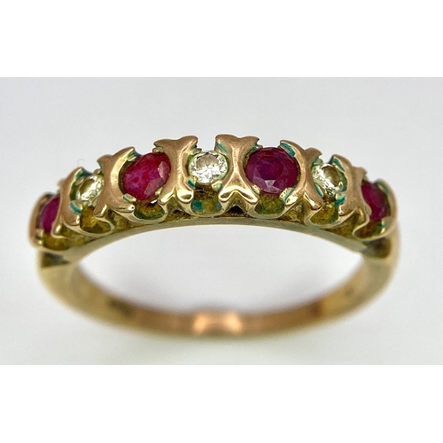 477 - A vintage, 9 K yellow gold ring with a band of alternating round cut diamonds and rubies. Size: N, w... 