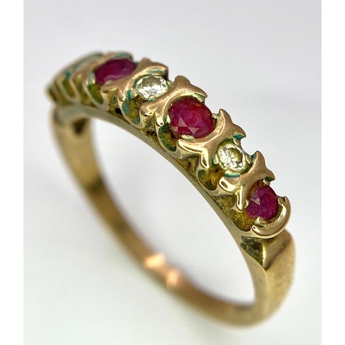 477 - A vintage, 9 K yellow gold ring with a band of alternating round cut diamonds and rubies. Size: N, w... 