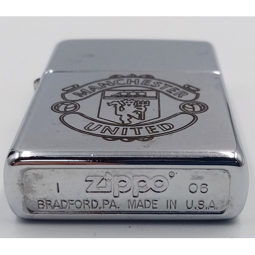 515 - A Manchester United Zippo Lighter Box Set with Tool and Empty Lighter Fluid Can. UK MAINLAND SALES O... 