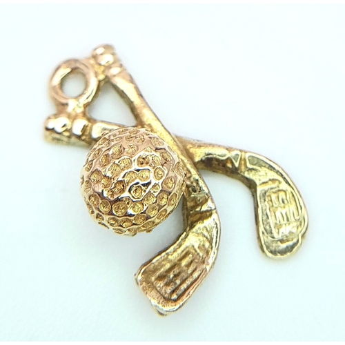 537 - A 14K YELLOW GOLD GOLF CLUBS CHARM. 1.9cm length, 2g weight. Ref: SC 8055