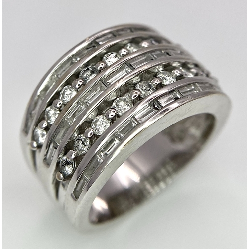 27 - AN 18K WHITE GOLD 5 ROW DIAMOND RING. MIXTURE OF ROUND BRILLIANT CUTS AND BAGUETTE CUT DIAMONDS. App... 