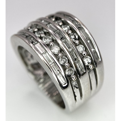 27 - AN 18K WHITE GOLD 5 ROW DIAMOND RING. MIXTURE OF ROUND BRILLIANT CUTS AND BAGUETTE CUT DIAMONDS. App... 