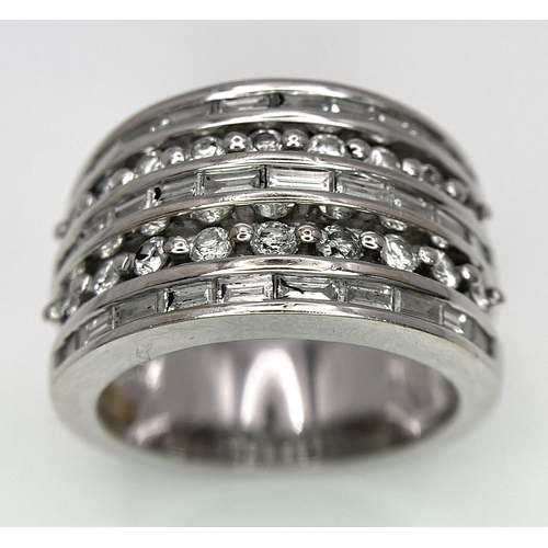 27 - AN 18K WHITE GOLD 5 ROW DIAMOND RING. MIXTURE OF ROUND BRILLIANT CUTS AND BAGUETTE CUT DIAMONDS. App... 