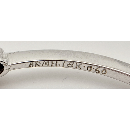 61 - AN 18K WHITE GOLD DIAMOND SET BANGLE. 0.30ctw, 5.1cm inner diameter, 8.5g total weight. Ref: SC 8069