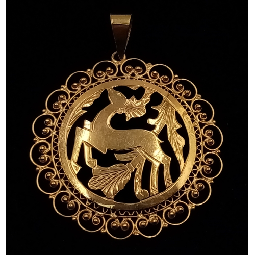 360 - A very elegant, 18 K yellow gold pendant with a deer and vegetation surrounded by refined scrollwork... 