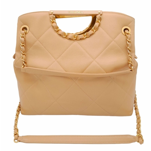 365 - A Chanel Two-Way Chain Shoulder Bag. Beige caviar leather.
Gold tone hardware. Spacious interior wit... 