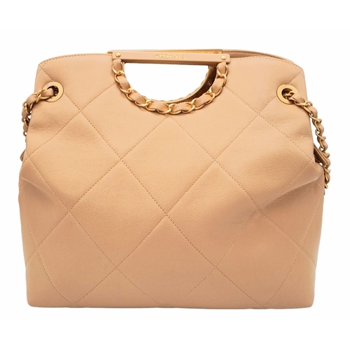 365 - A Chanel Two-Way Chain Shoulder Bag. Beige caviar leather.
Gold tone hardware. Spacious interior wit... 