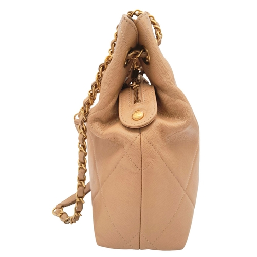 365 - A Chanel Two-Way Chain Shoulder Bag. Beige caviar leather.
Gold tone hardware. Spacious interior wit... 