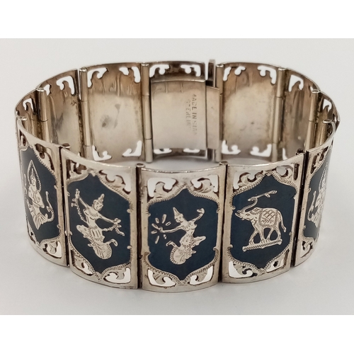 488 - A SILVER FANCY LINK INDIAN GODS BRACELET. 17.8cm length, 32.9g total weight. Ref: SC 8071