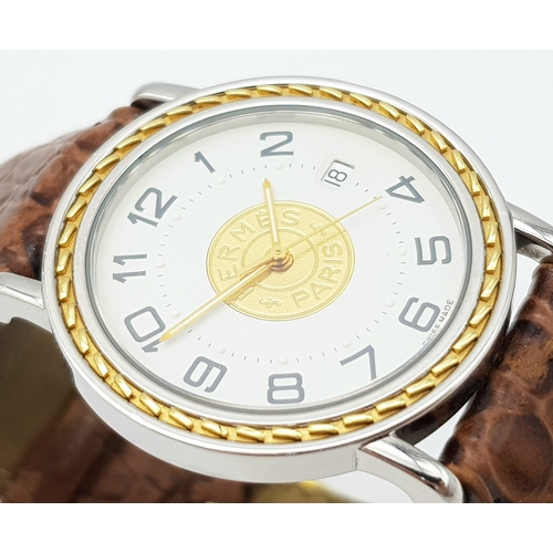 284 - A FABULOUS HERMES OF PARIS GENTS WATCH WITH WHITE DIAL AND CIRCULAR CENTRAL LOGO ON A BROWN CROCODIL... 