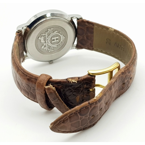 284 - A FABULOUS HERMES OF PARIS GENTS WATCH WITH WHITE DIAL AND CIRCULAR CENTRAL LOGO ON A BROWN CROCODIL... 