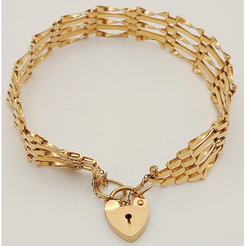 353 - A 9 K yellow gold bracelet with a padlock clasp and safety chain, length: 18 cm, weight: 5.9 g.