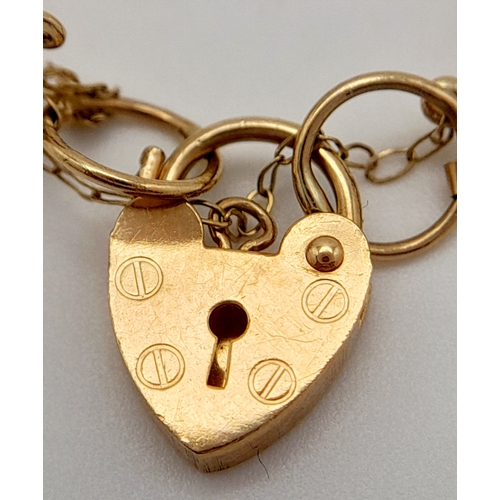 353 - A 9 K yellow gold bracelet with a padlock clasp and safety chain, length: 18 cm, weight: 5.9 g.