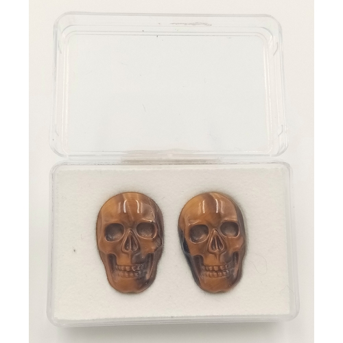 369 - A PAIR OF TIGERS EYE CARVED MATCHING SKULLS - VERY RARE AND UNUSUAL. 20MM X 15.5MM