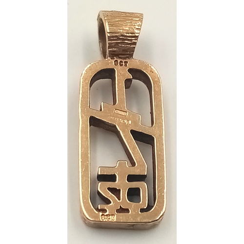 374 - A 9K yellow gold pendant in the shape of  