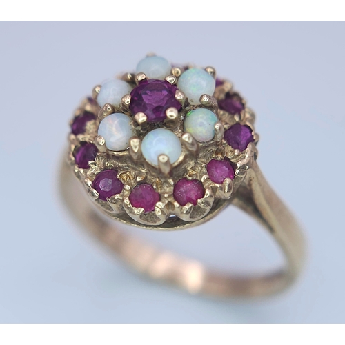 221 - A 9K YELLOW GOLD GARNET AND OPAL CLUSTER RING. Size O, 3.8g total weight. Ref: SC 8088