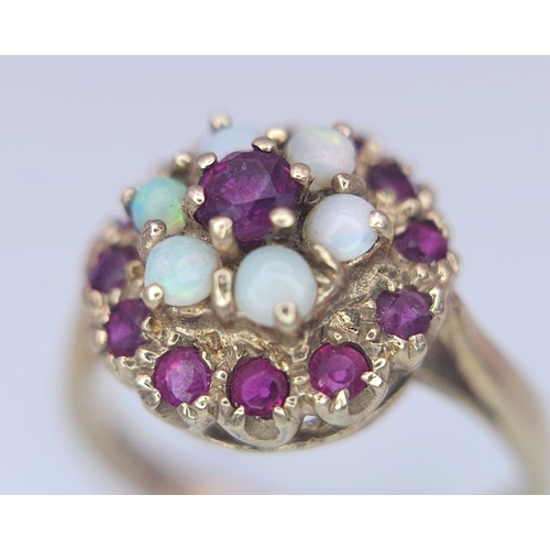 221 - A 9K YELLOW GOLD GARNET AND OPAL CLUSTER RING. Size O, 3.8g total weight. Ref: SC 8088