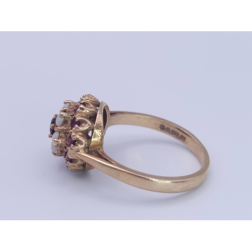 221 - A 9K YELLOW GOLD GARNET AND OPAL CLUSTER RING. Size O, 3.8g total weight. Ref: SC 8088