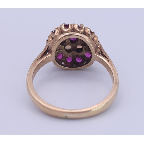 221 - A 9K YELLOW GOLD GARNET AND OPAL CLUSTER RING. Size O, 3.8g total weight. Ref: SC 8088