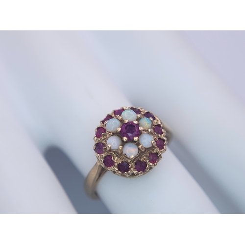 221 - A 9K YELLOW GOLD GARNET AND OPAL CLUSTER RING. Size O, 3.8g total weight. Ref: SC 8088