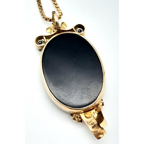 255 - A Beautiful 9K Gold, Cameo Pendant with Sapphire and Diamond decoration on a 9K link chain. Pendant ... 