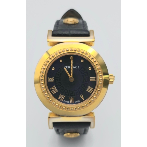 283 - A Versace Designer Quartz Ladies Watch. Black leather and gilded strap and case - 35mm. Black dial w... 