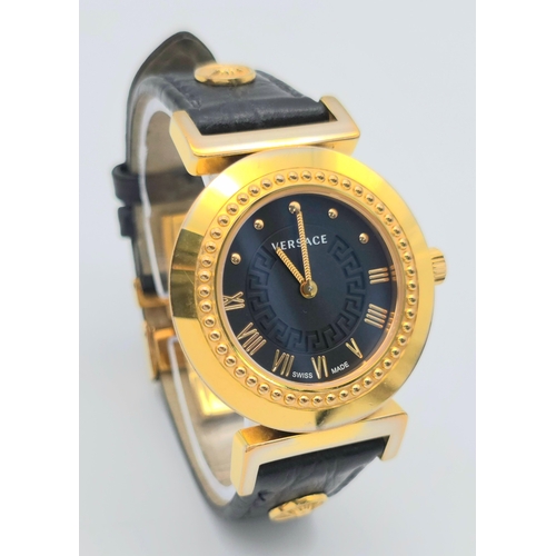 283 - A Versace Designer Quartz Ladies Watch. Black leather and gilded strap and case - 35mm. Black dial w... 