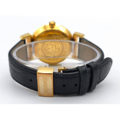 283 - A Versace Designer Quartz Ladies Watch. Black leather and gilded strap and case - 35mm. Black dial w... 