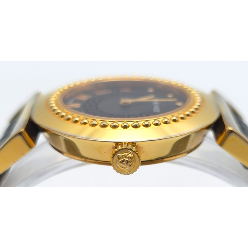 283 - A Versace Designer Quartz Ladies Watch. Black leather and gilded strap and case - 35mm. Black dial w... 