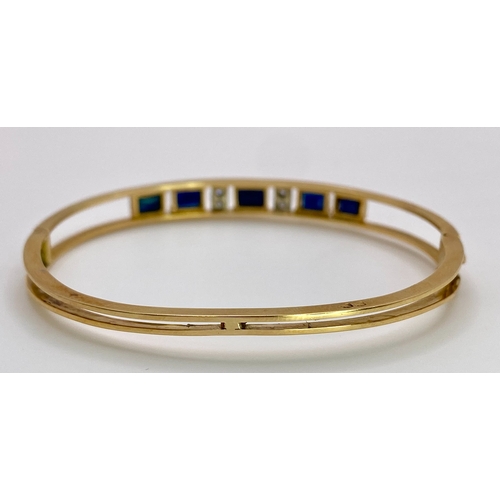 29 - A 14K (TESTED AS) YELLOW GOLD BANGLE SET WITH 5 SAPPHIRES AND 4 DIAMONDS, 6CM DIAMETER, 15.9G (DIA:0... 