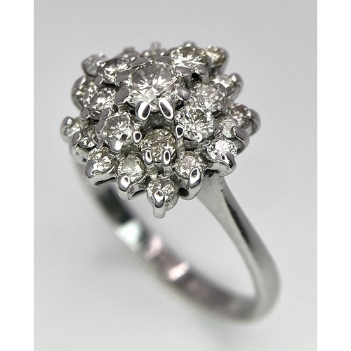 296 - An 18K White Gold Diamond Floral Cluster Ring. Size O. 4.5g total weight. Ref: 16987