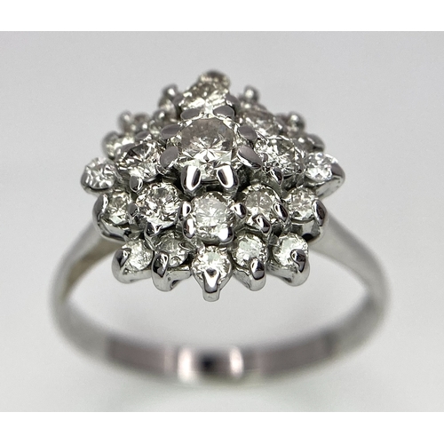 296 - An 18K White Gold Diamond Floral Cluster Ring. Size O. 4.5g total weight. Ref: 16987