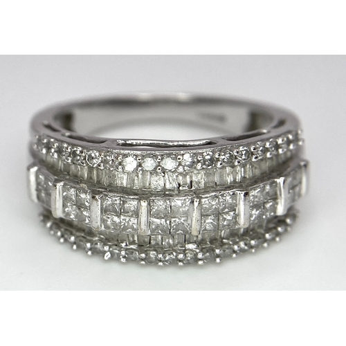 311 - A 9K White Gold Mixed Cut Diamond Ring. Five rows of, square, round and baguette cut diamonds. Size ... 