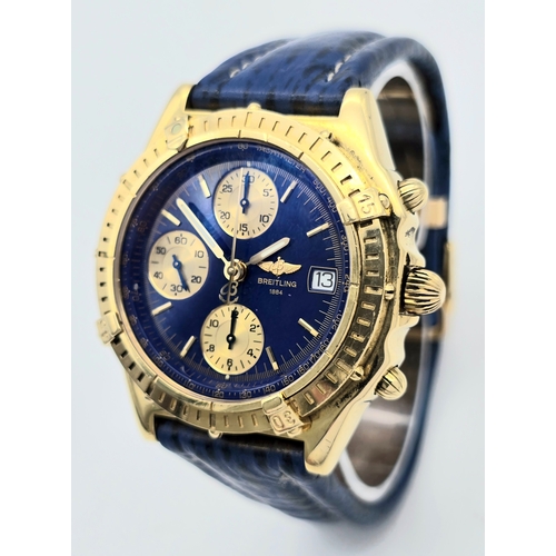 316 - An 18K Gold Breitling Chronograph Gents Watch. Breitling blue leather strap with 18k gold clasp. 18k... 