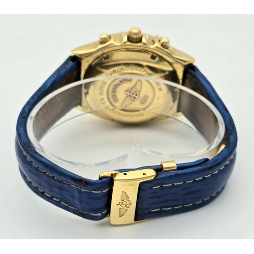 316 - An 18K Gold Breitling Chronograph Gents Watch. Breitling blue leather strap with 18k gold clasp. 18k... 