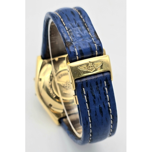 316 - An 18K Gold Breitling Chronograph Gents Watch. Breitling blue leather strap with 18k gold clasp. 18k... 