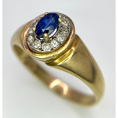 320 - A 9K YELLOW GOLD, DIAMOND AND SAPPHIRE RING. 2.7G. SIZE N.