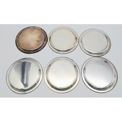 340 - A SET OF SIX SOLID SILVER COASTERS IN 800 SILVER , NICELY EDGED AND BEING 10cms in DIAMETER .    316... 